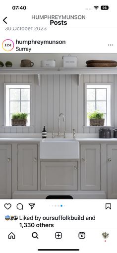 a kitchen with white cabinets and an instagramting post on the bottom right corner