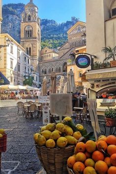 there are many fruits in baskets on the street