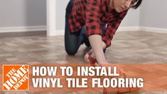 a woman kneeling down on the floor with a tool in her hand and text overlay how to install vinyl tile flooring