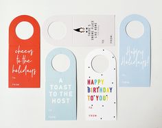 four door hangers with happy birthday messages on the front and one has an arrow