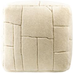 a white square cushion with squares on the front and back, made out of fleey material