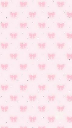 a pink wallpaper with small bows on the top and bottom half, all over it