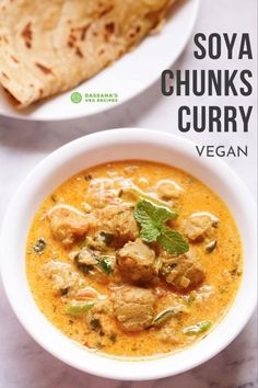 two bowls filled with soup next to pita bread on a white counter top and the title says soy chunks curry vegan