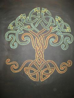 a drawing of a tree on a blackboard with an intricate design in the middle