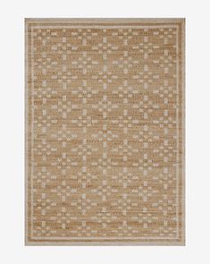 an area rug with squares and dots on the side, in neutral colors against a white background