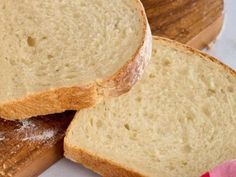 two slices of bread sitting on top of a cutting board