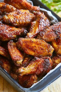 some chicken wings in a pan on a table