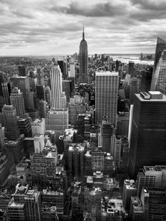 black and white photograph of new york cityscape taken from the empire state building