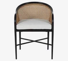 a black and white chair with wicker back