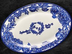 a blue and white plate with flowers on it