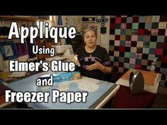 a woman sitting at a table with a computer mouse in front of her and the words applique using elmer's glue and freezer paper