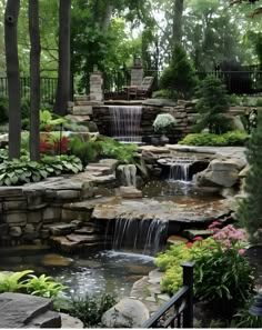 an outdoor waterfall in the middle of a garden