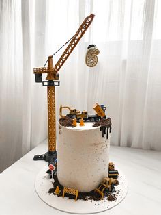 a construction themed cake is displayed on a table