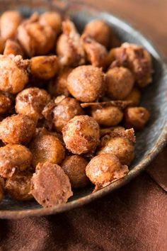 a bowl filled with nuts on top of a table