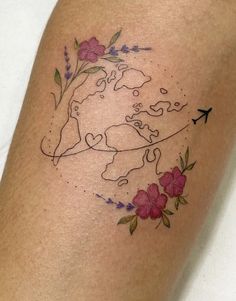 a woman's arm with flowers and an arrow on the back of her leg