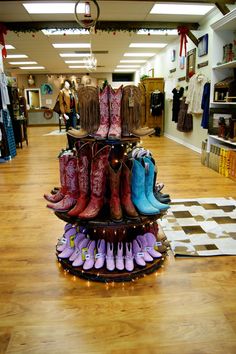 Boot Display.  We used old spools and some Christmas Lights for a cool-looking display. Boot Display Retail, Spool Display Ideas, Boot Display Ideas, Western Store Display Ideas, Boot Display, Feed Store, Boot Tree, Tack Store, Boot Storage