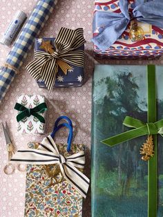 several wrapped presents are sitting on a table