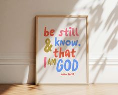 a framed poster with the words be still and know that i am god on it