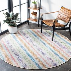 a chair and table in a room with a rug on the floor next to it