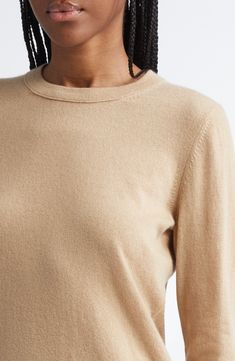 Ultrasoft cashmere yarns give luxurious softness to this classic sweater with ribbed trim. 22" length (size Medium) Crewneck Long sleeves 100% cashmere Dry clean or hand wash, dry flat Imported Beige Fine Knit Cashmere Sweater, Fine Knit Beige Cashmere Sweater, Classic Cashmere Cream Top, Classic Beige Cashmere Tops, Beige Cashmere Top With Ribbed Collar, Beige Cashmere Tops With Ribbed Collar, Classic Brown Cashmere Top, Cashmere Yarn, Classic Sweater