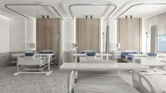 an empty hospital room with multiple beds and chairs