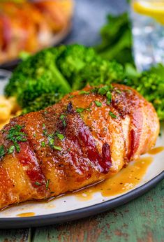 a close up of a plate of food with meat and broccoli on it