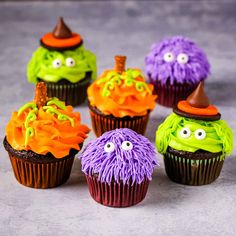 halloween cupcakes with colorful frosting and sprinkles in the shape of monsters