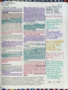 an open bible with colorful writing on it