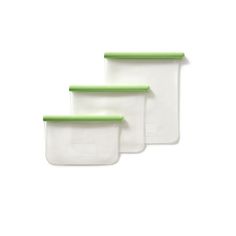 three plastic storage containers with green lids