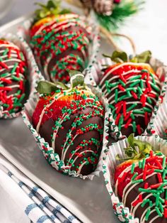 chocolate covered strawberries with christmas sprinkles on them