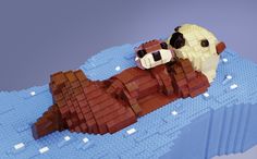 a lego model of a dog laying on top of a large piece of plastic bricks