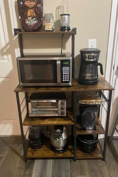 a microwave, toaster and coffee maker on a shelf