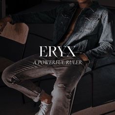 a man sitting on top of a wooden chair next to a black wall with the words eryx