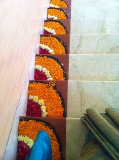 the steps are lined up with flowers and petals on them, along with blue pants