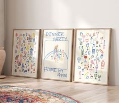 three framed art pieces on the floor in front of a vase and potted plant