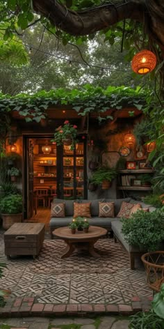 an outdoor living room with lots of greenery