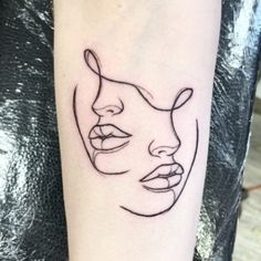 a woman's face on the arm with lines drawn across it and behind her