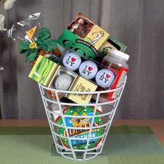 a white basket filled with golf balls and other assorted items on top of a table