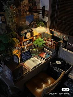 a cluttered desk with many books and plants