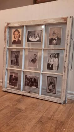 an old window is filled with family photos on the floor in front of a wall