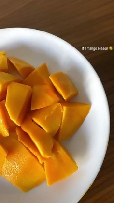 a white plate topped with cut up mangoes