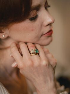 a close up of a person wearing a ring