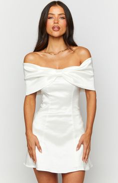 White Off Shoulder Mini Dress

How to style:
Whether it's homecoming, your birthday or a special occasion, this white bow mini dress () is the cutest ensemble. The sophisticated and elegant mini dress () that will capture the hearts of all fashion lovers. Pair this divine mini dress with stilettos and a shoulder bag to accessorise﻿ (). 

Features:
  
 * Mid weight material 
 * Off the shoulder style 
 * Large bow detailing on bust 
 * Invisible zip left side  
 * Inner bust grip 
 * Fully lined White Preference Dress, White Satin Off The Shoulder Dress, Simple White Short Dress Classy, Mini Dresses Elegant, White Dress Bow Back, Off Shoulder Elegant Dress, White Bow Dress Short, White Dress Sleeve, White Dress With Bows On Shoulders