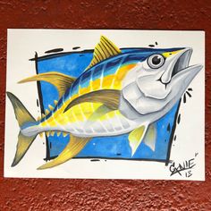 a drawing of a fish on a red wall with blue and yellow colors, it looks like he's smiling