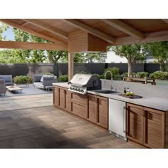 an outdoor kitchen with wood cabinets and white appliances