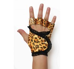 a woman's hand wearing leopard print gloves with lace on the wrist and fingers