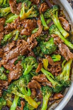 beef and broccoli stir fry in a skillet on top of a table