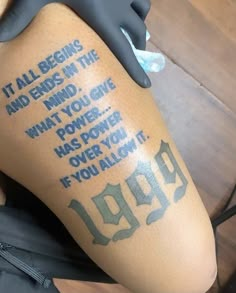 a person with a tattoo on their leg that reads, it all begins and ends in the end