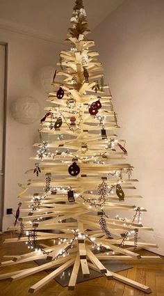 a christmas tree made out of wooden strips