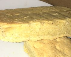 two pieces of bread sitting on top of a white plate